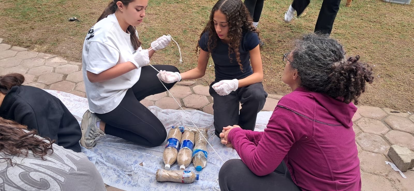Students examining fossils on a field trip